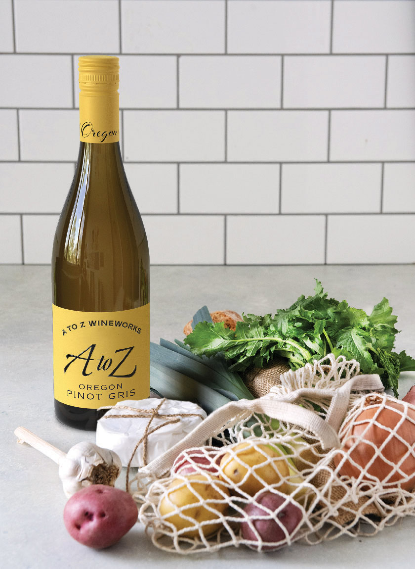 A to Z Pinot Gris on counter with potatoes and salad