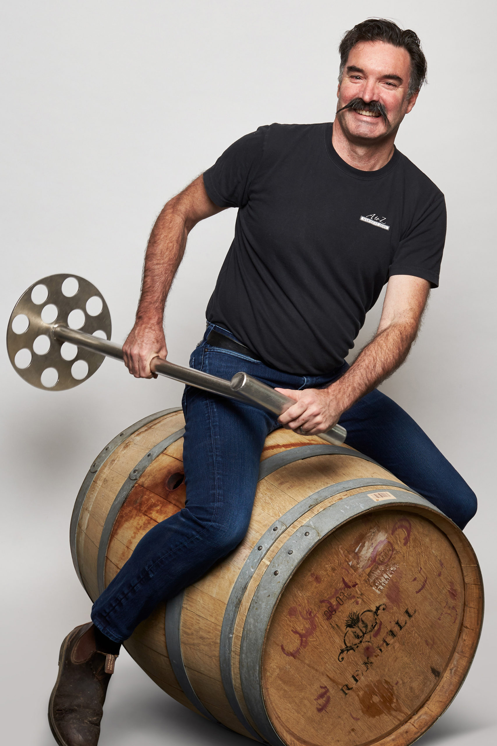Michel rowing on barrel with tool