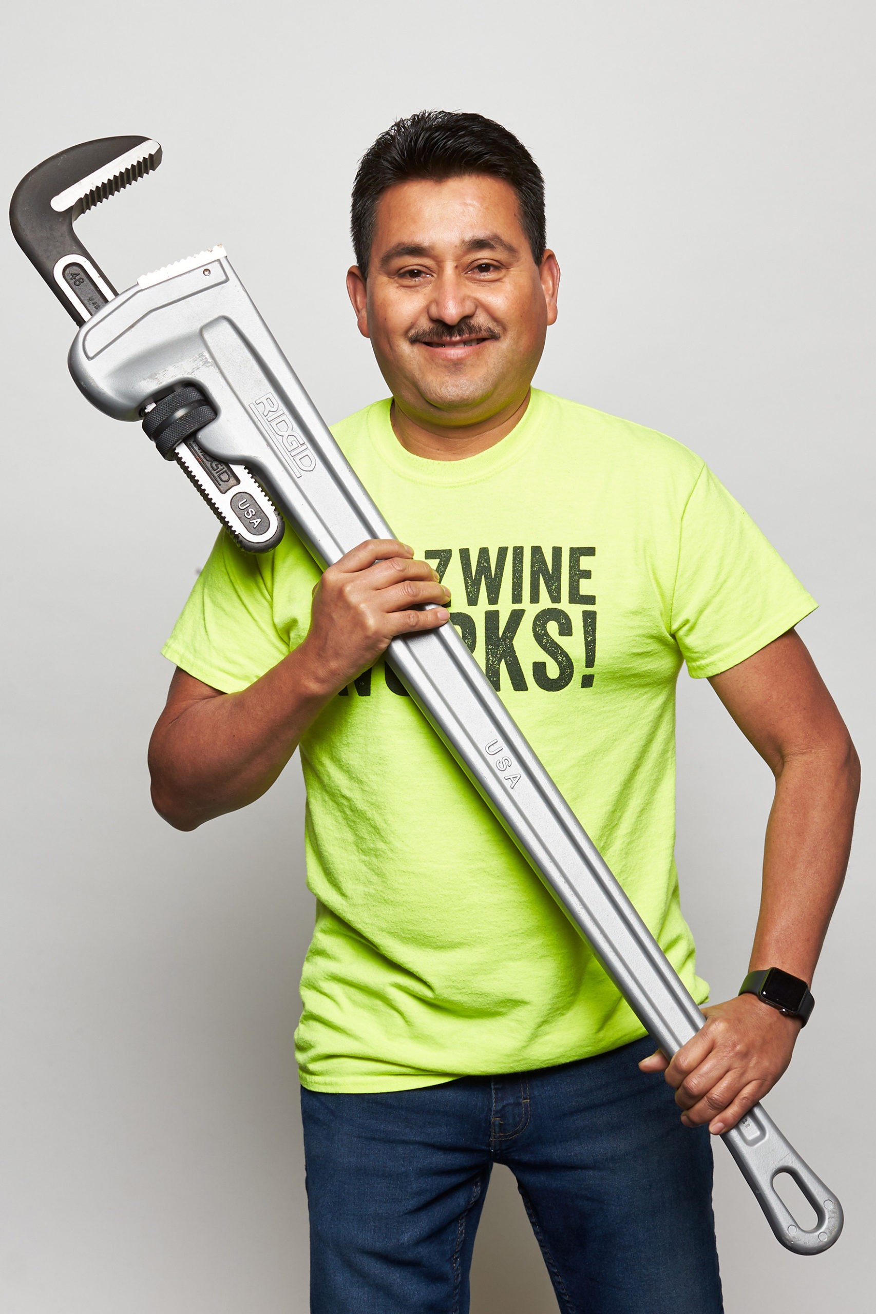Aurelio holding large wrench WAAZ