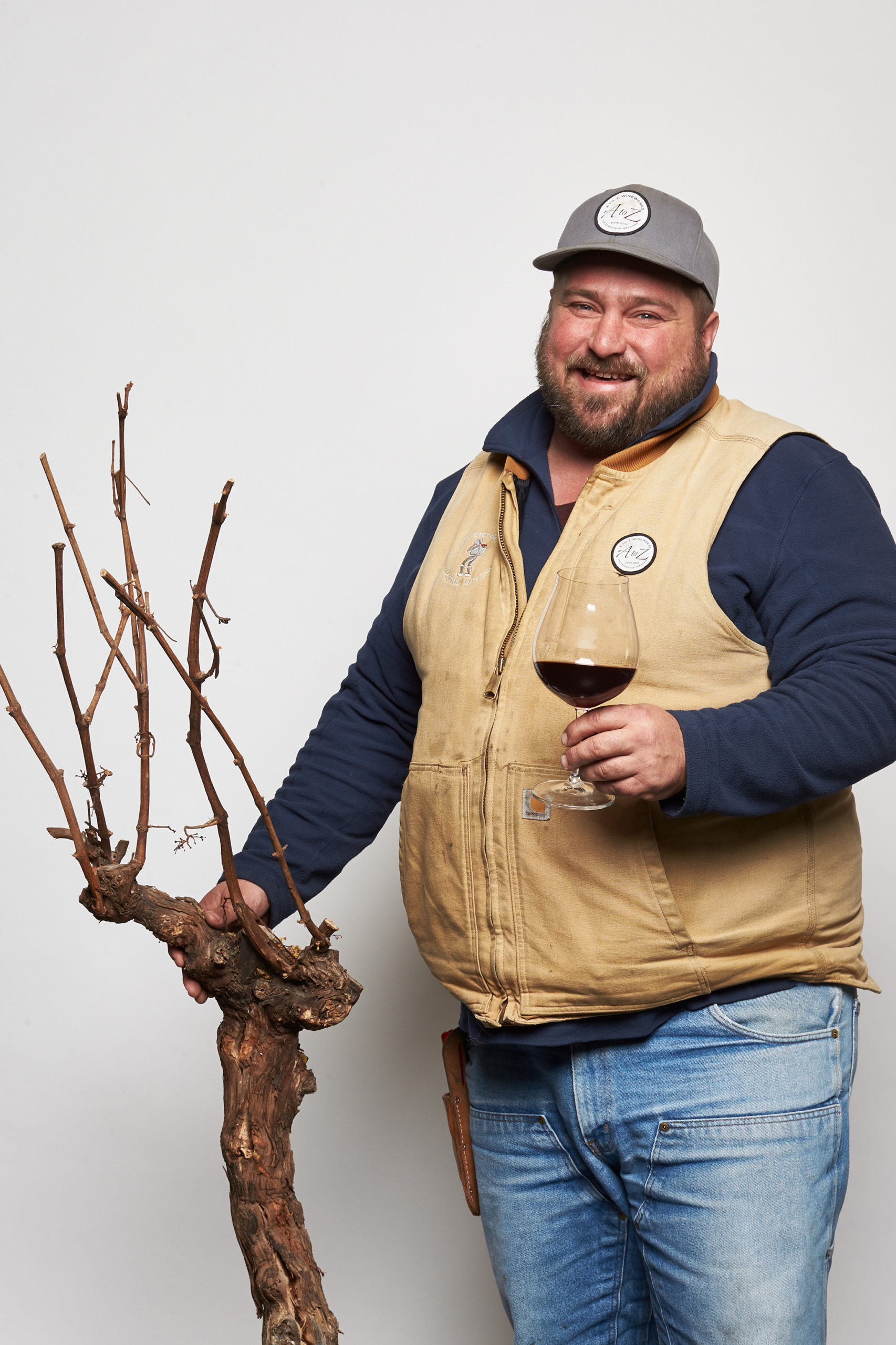 Joey holding old vine and wine