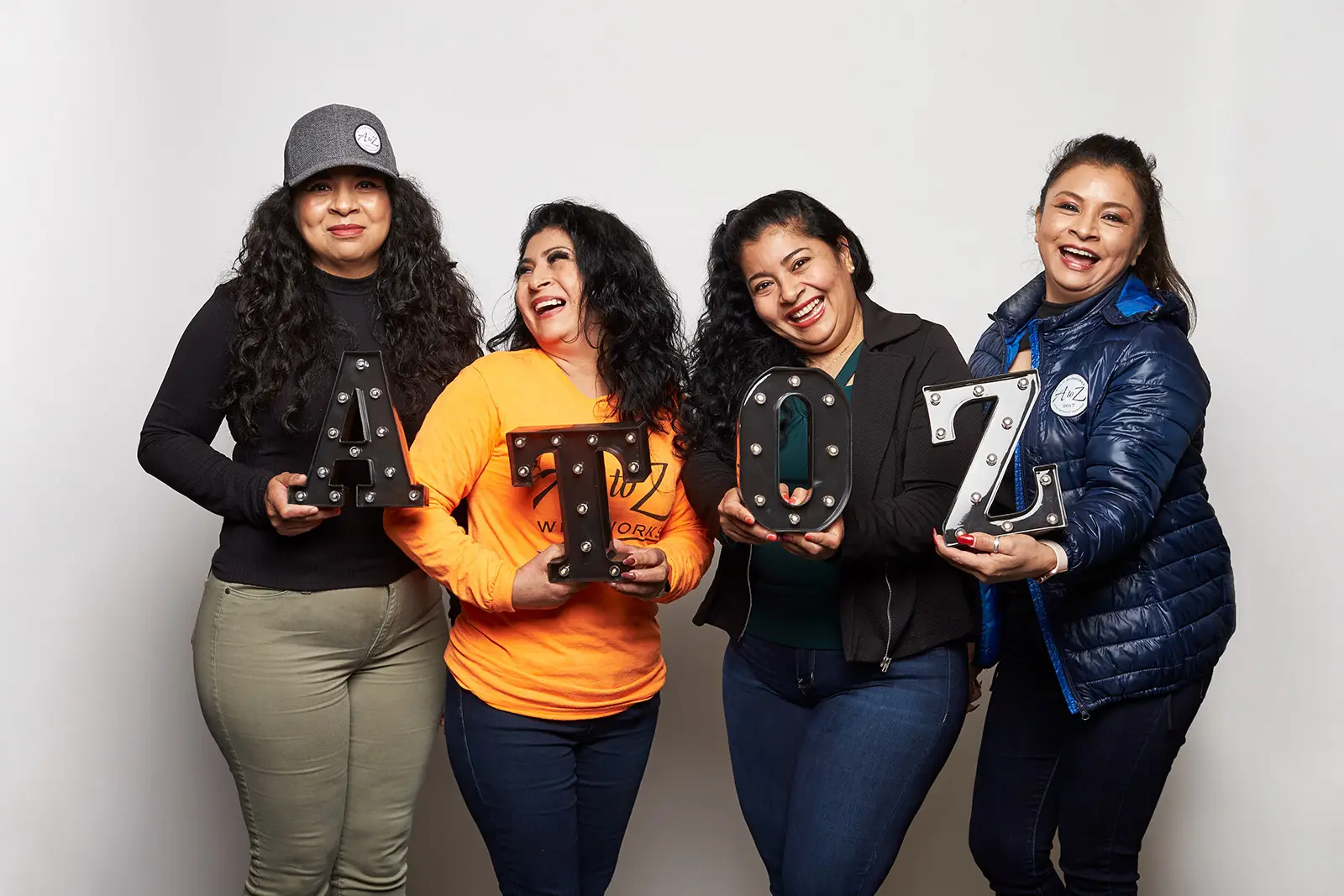 Employees holding A to Z letters